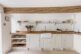 Scandinavian white kitchen in a cotswald cottage