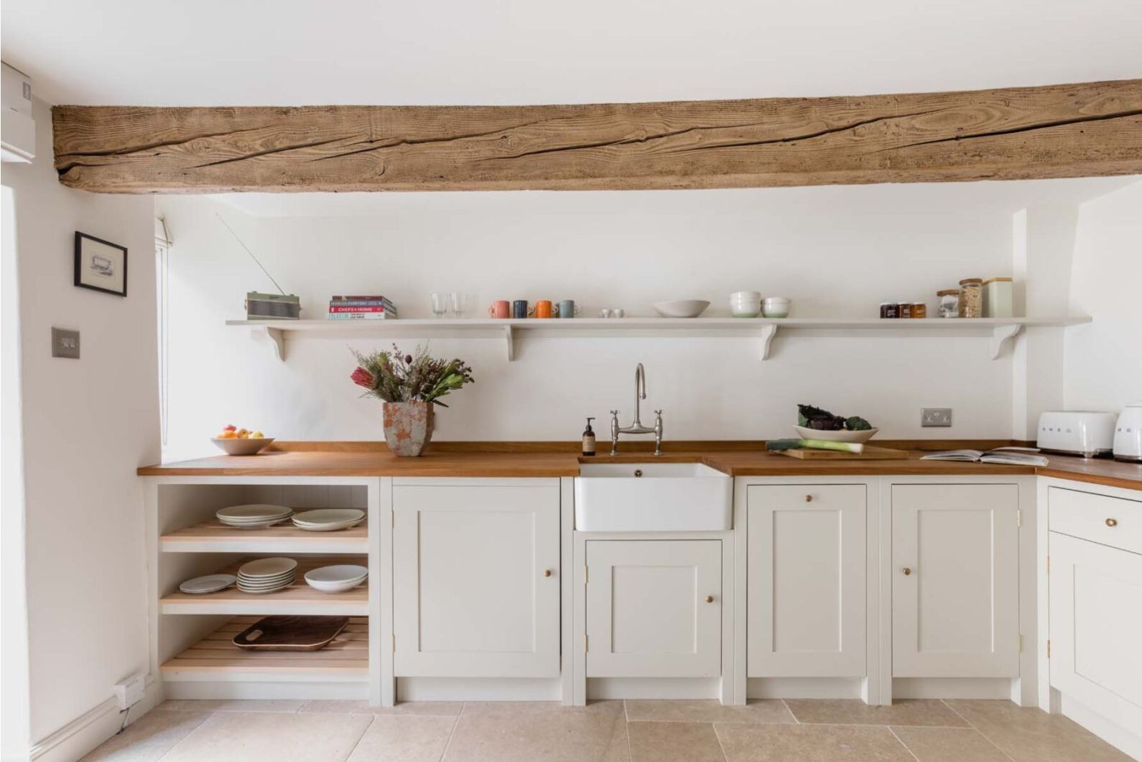 Scandinavian white kitchen in a cotswald cottage